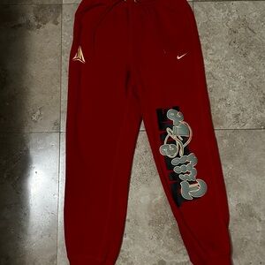 Nike Kids Red Joggers with Graphic Design